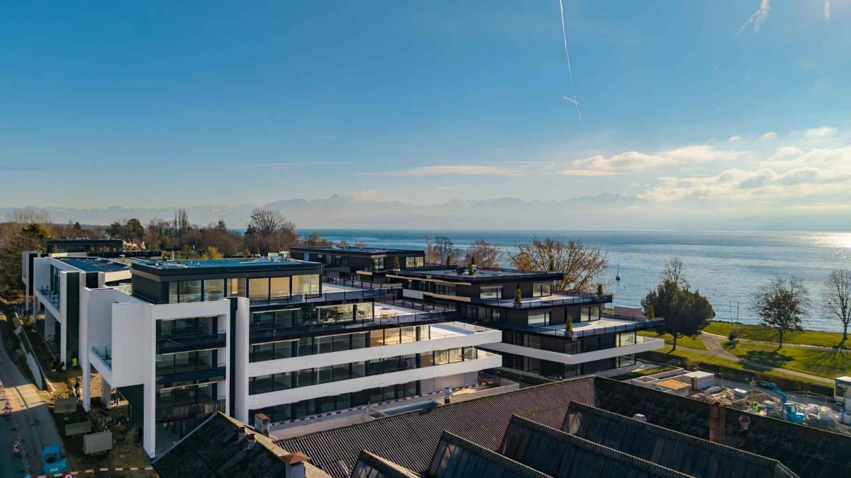 Luxueux 4.5 pièces traversant avec balcon couvert de 76m2 et vue lac