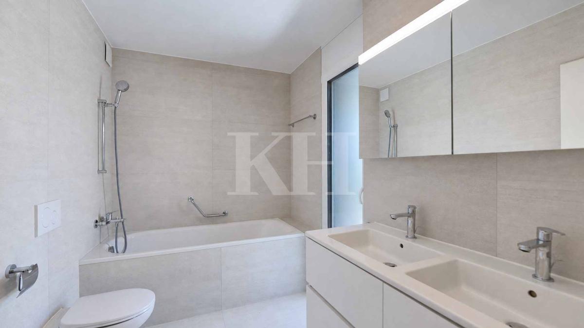 Appartement de 5,5 pièces neuf avec magnifiques finitions en rez de jardin !