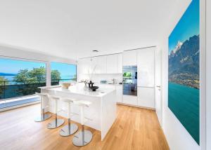 Luxueux 4.5 pièces traversant avec balcon couvert de 76m2 et vue lac