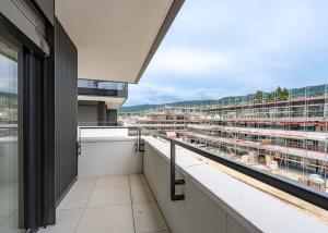 UNIQUE! Attique de 5.5 pièces de 180m2 bénéficiant d'un rooftop terrasse de 168m2 avec vue panoramique sur le lac et les Alpes