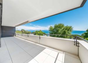 Luxueux 4.5 pièces traversant avec balcon couvert de 76m2 et vue lac