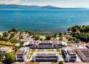 Luxueux 4.5 pièces traversant avec balcon couvert de 76m2 et vue lac