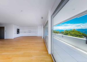 Luxueux 4.5 pièces traversant avec balcon couvert de 76m2 et vue lac