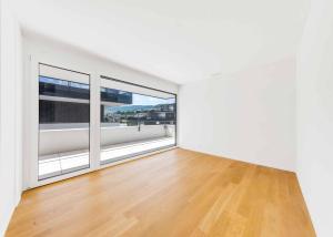 Luxueux 4.5 pièces traversant avec balcon couvert de 76m2 et vue lac