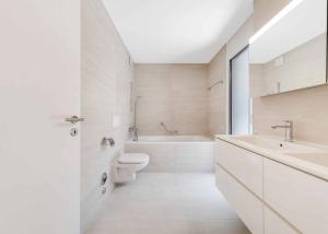 Luxueux 4.5 pièces traversant avec balcon couvert de 76m2 et vue lac