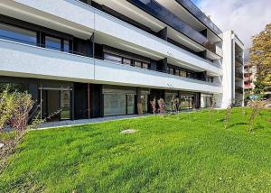 Appartement neuf de 3.5 pièces avec 2 terrasses et 2 jardins Ouest/Est