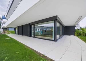 Appartement neuf de standing - 5.5 pièces en angle avec terrasse et jardin privatif