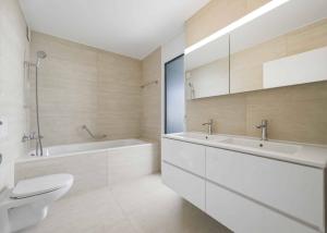 Appartement neuf de standing - 5.5 pièces en angle avec terrasse et jardin privatif