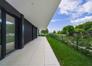 Appartement neuf de standing - 5.5 pièces en angle avec terrasse et jardin privatif