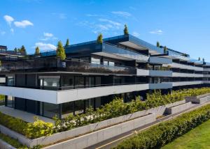 Appartement neuf de standing - 5.5 pièces en angle avec terrasse et jardin privatif