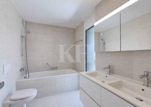 Appartement de 5,5 pièces neuf avec magnifiques finitions en rez de jardin !